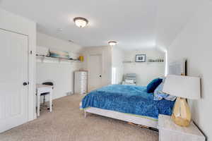 Bedroom featuring vaulted ceilings walk in closet and lots of extra space