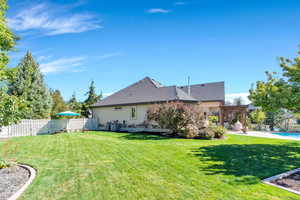 Back of property featuring a pergola and a patio area