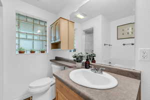 Full bath featuring vanity and a shower with shower door