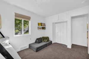 Sitting room with carpet flooring and baseboards
