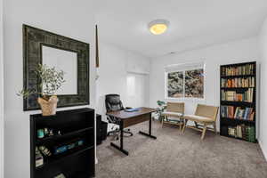 View of carpeted home office