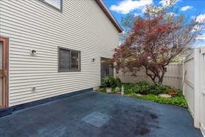Fenced backyard with a patio