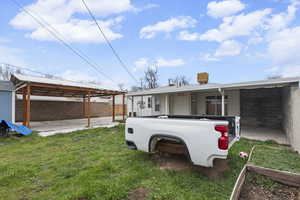 Rear view of house featuring a patio