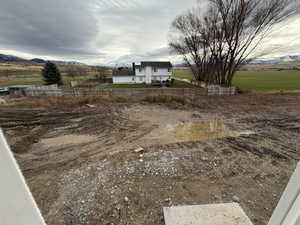 View of yard featuring a view of countryside and a mountain view