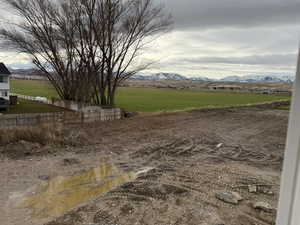 View of yard with a view of rural / pastoral area and a mountain view
