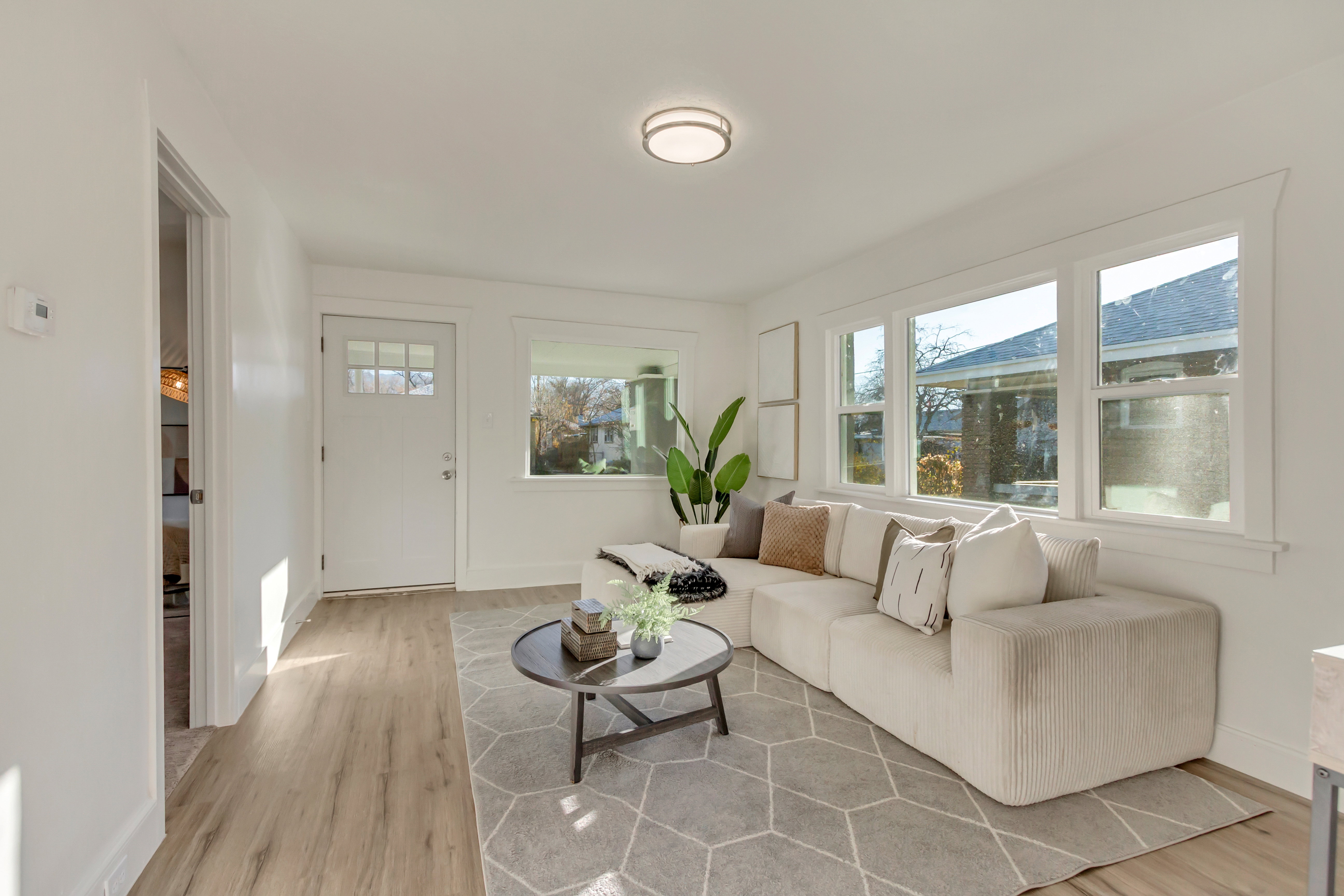 Living area with light wood-type flooring and baseboards