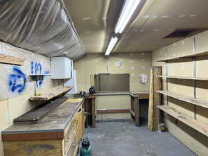 Miscellaneous room with a workshop area