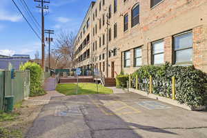 View of property with uncovered parking