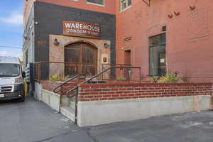 Entrance to property with brick siding