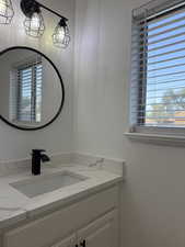 Bathroom with vanity and healthy amount of natural light
