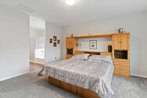 Spacious primary suite with walk-in closet, double vanity, soaking tub, and separate shower