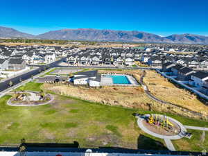 Aerial view of residential area featuring a mountain backdrop