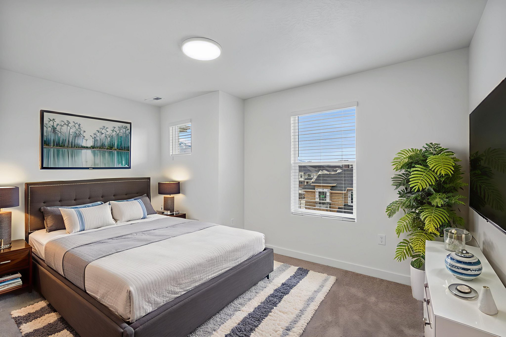Bedroom with baseboards and dark colored carpet