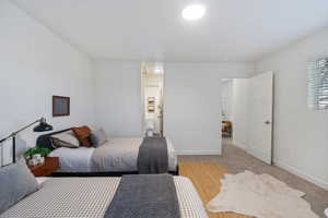 Bedroom featuring carpet and ensuite bathroom
