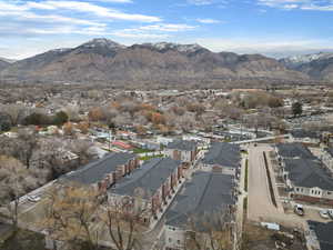 View of mountain background featuring nearby suburban area