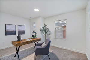 Carpeted bedroom or optional office featuring healthy amount of natural light