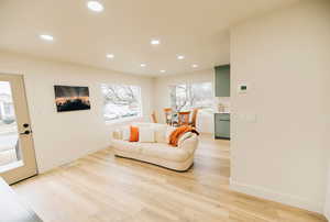 Living area featuring recessed lighting and light wood-type flooring