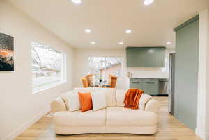 Living room featuring recessed lighting and light wood-style flooring