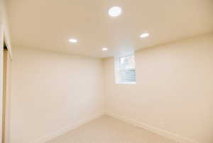 Empty room featuring recessed lighting and carpet floors