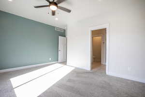 Unfurnished bedroom featuring light carpet, a ceiling fan, and recessed lighting