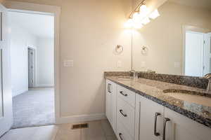 Full bathroom with double vanity, light colored carpet, and light tile patterned flooring