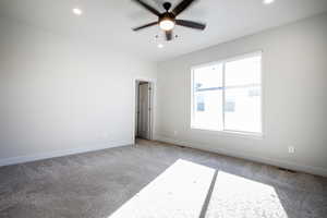 Spare room with carpet, recessed lighting, and ceiling fan