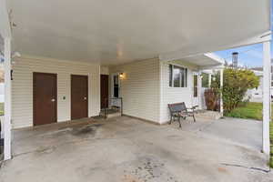 View of patio with a carport