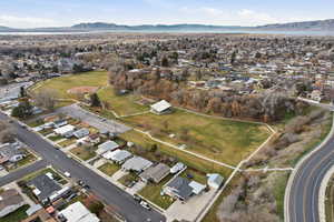 Aerial view of property's location featuring nearby suburban area and a mountain backdrop