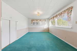 Spare room with carpet flooring and baseboards