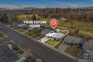 View of property location featuring a mountainous background and nearby suburban area