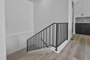 Stairway featuring baseboards