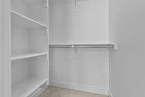 Spacious closet with carpet floors