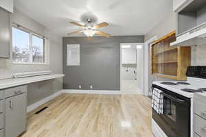 Free standing electric range/oven, built in hutch, and dining area