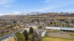 Aerial view of a mountainous background and the city owned open space area behind the home