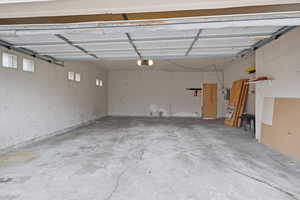 View of attached 2 car garage with openers