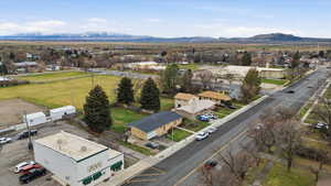 Aerial view of a mountain backdrop and the city owned open space area behind the home