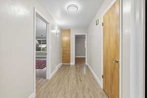 Large entryway has a coat closet and built-in storage. The entire home has many new led light fixtures and fresh paint