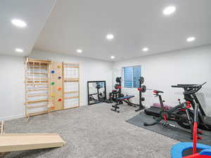 Workout area with recessed lighting and carpet