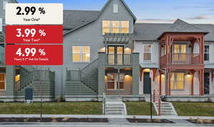 View of front of house with a shingled roof, stucco siding, stairway, and a front lawn