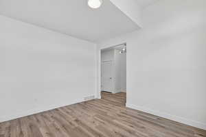 Unfurnished room with light wood finished floors