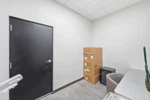 Office area with a paneled ceiling