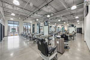 Exercise room featuring a towering ceiling