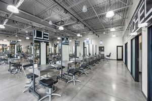 Workout area with a towering ceiling