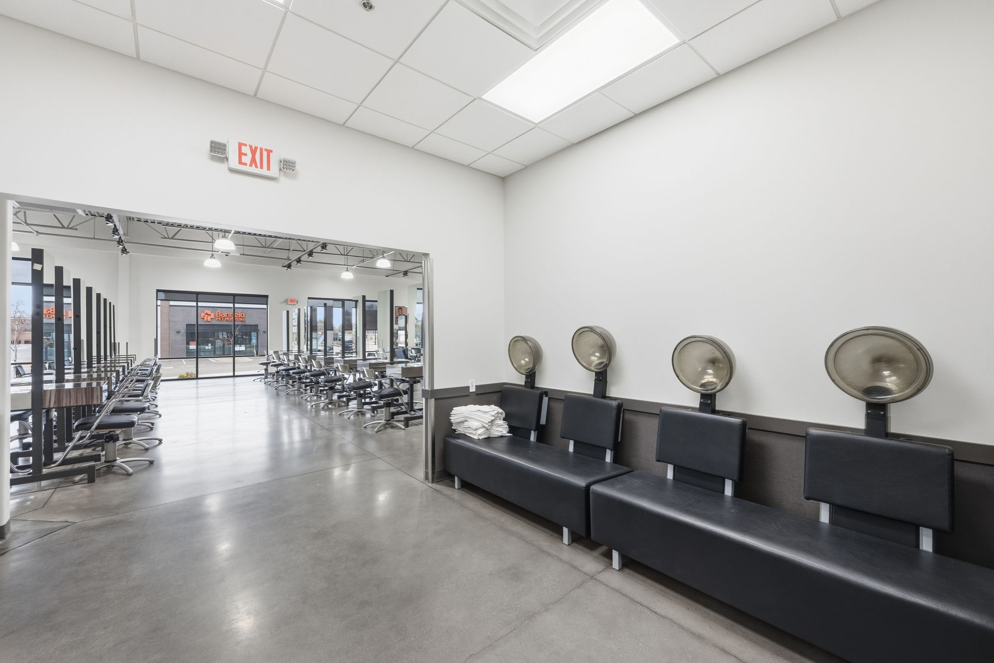 Community lobby featuring a paneled ceiling and a high ceiling