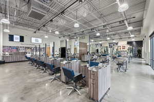 Miscellaneous room with a towering ceiling and a heating unit