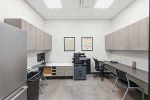 Office space featuring a paneled ceiling