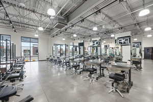 Exercise room featuring a high ceiling