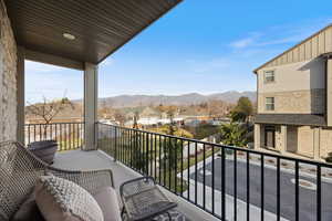 Balcony featuring a mountain view and a residential view