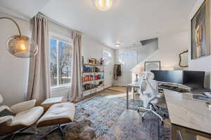 Office with wood finished floors