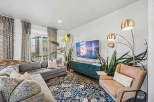 Living room featuring wood finished floors and recessed lighting